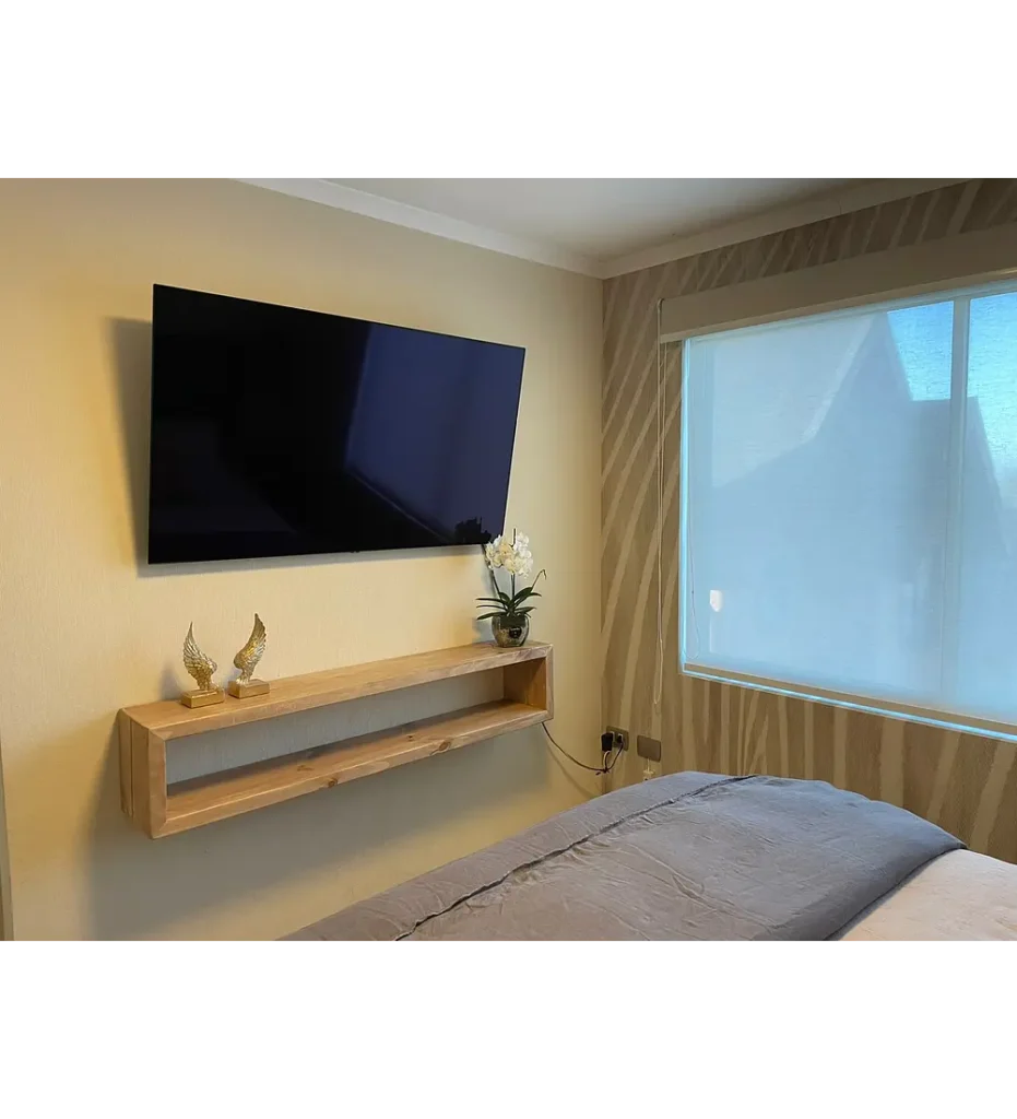 cozy living room with a rustico tv setup and wooden decor